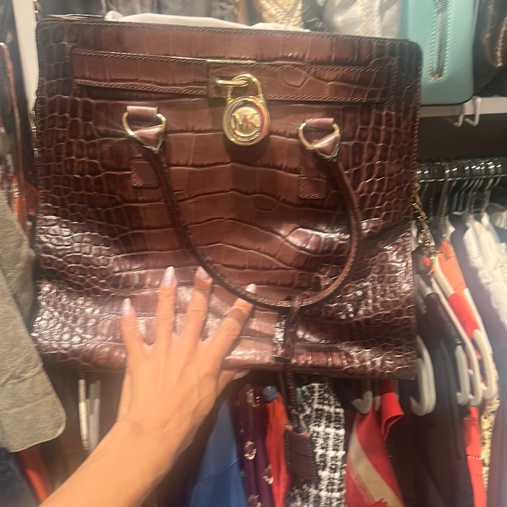 Brown Michael Kors bag with top handles and straps